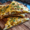 Cheese Naan au Poulet au Curry de Cheddar, plat savoureux et réconfortant.