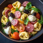Pasta salad with tortellini, salami, and mozzarella